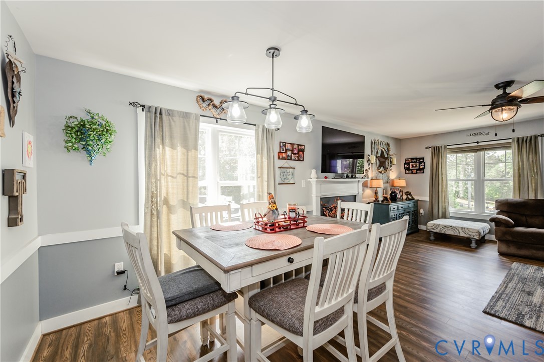 915 Manchester Road Bumpass, VA 23024 - Photo 11 of 49 a view of a dining room with furniture window and wooden floor