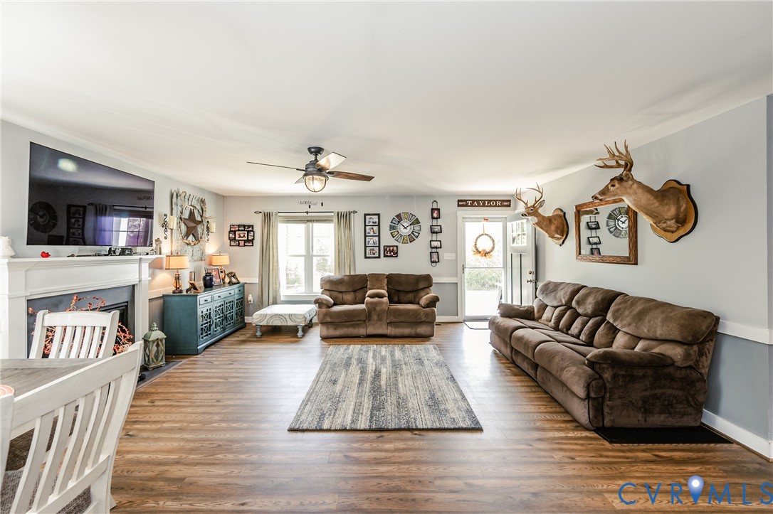 915 Manchester Road Bumpass, VA 23024 - Photo 13 of 49 a living room with furniture and a flat screen tv