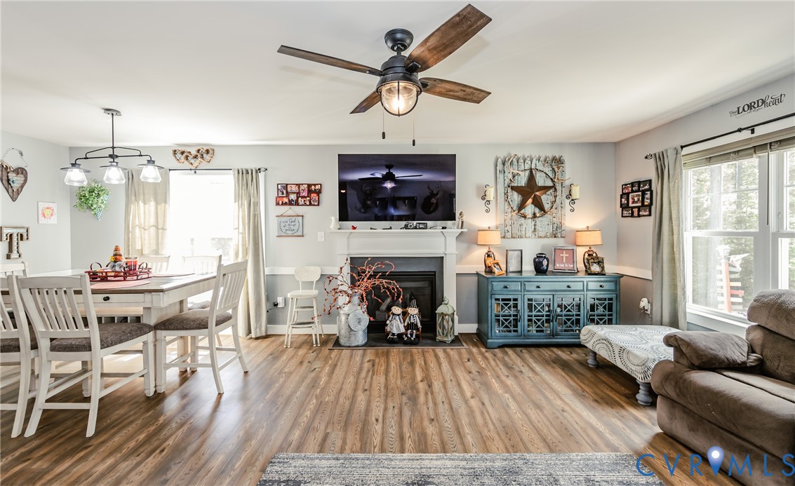 915 Manchester Road Bumpass, VA 23024 - Photo 15 of 49 a living room with furniture a fireplace and a flat screen tv