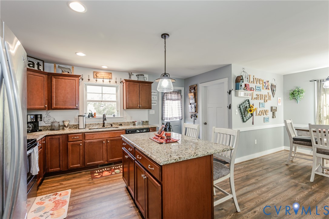915 Manchester Road Bumpass, VA 23024 - Photo 17 of 49 a kitchen with stainless steel appliances granite countertop a sink stove and refrigerator