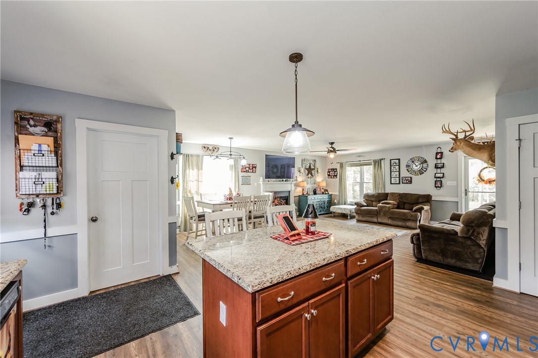915 Manchester Road Bumpass, VA 23024 - Photo 18 of 49 a kitchen with stainless steel appliances granite countertop a sink dishwasher and a flat screen tv