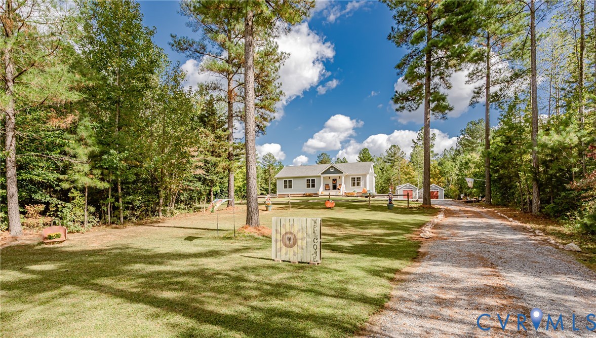 915 Manchester Road Bumpass, VA 23024 - Photo 2 of 49 a view of a playground with basketball court