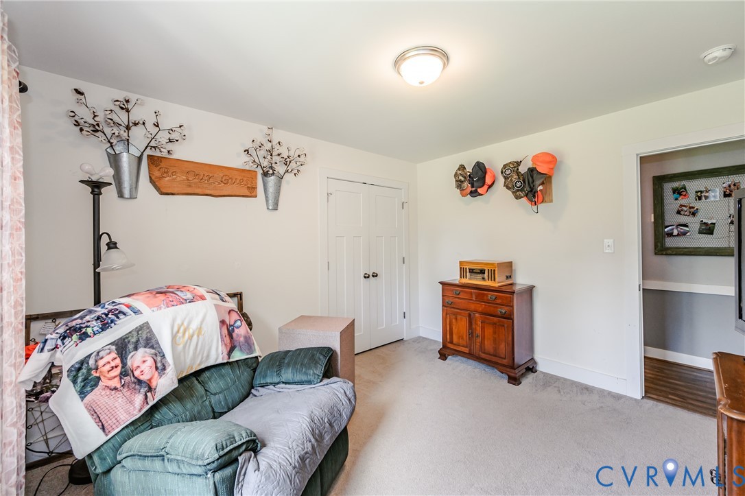 915 Manchester Road Bumpass, VA 23024 - Photo 27 of 49 a bedroom with furniture and a bed