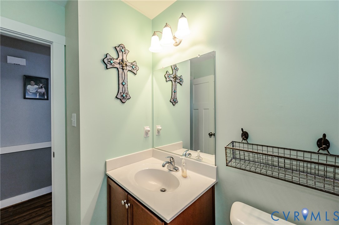 915 Manchester Road Bumpass, VA 23024 - Photo 29 of 49 a bathroom with a sink and mirror