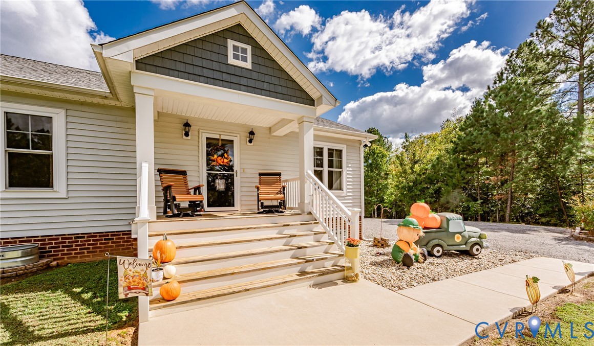 915 Manchester Road Bumpass, VA 23024 - Photo 3 of 49 a view of house with wooden floor and outdoor seating