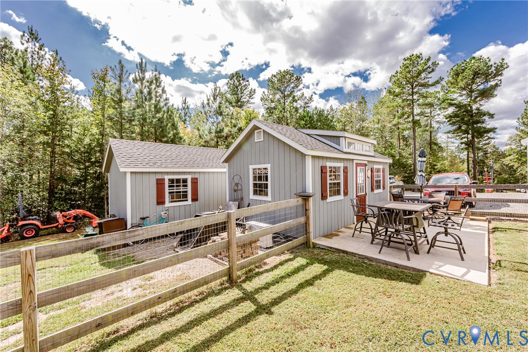 915 Manchester Road Bumpass, VA 23024 - Photo 38 of 49 a view of a house with backyard and sitting area