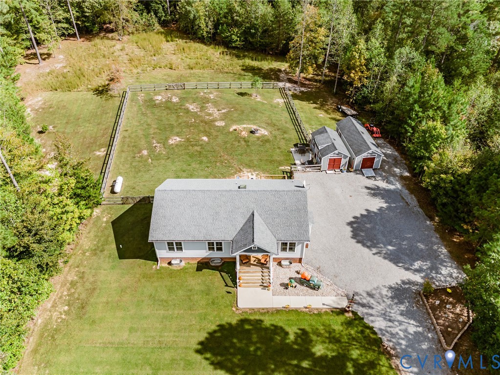 915 Manchester Road Bumpass, VA 23024 - Photo 47 of 49 an aerial view of a house with swimming pool and large trees