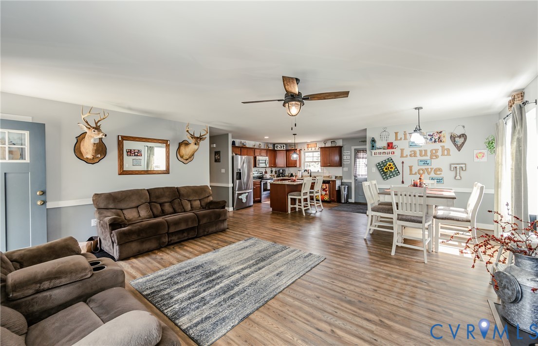 915 Manchester Road Bumpass, VA 23024 - Photo 9 of 49 a living room with furniture and wooden floor