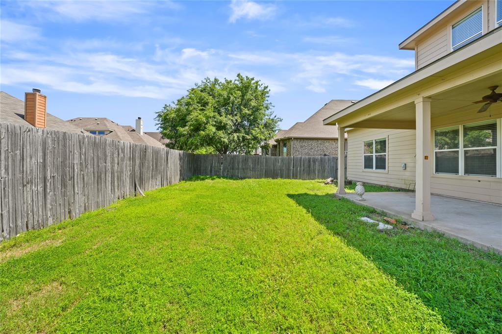 2003 Diamondback Forney, TX 75126 - Photo 29 of 30 View of yard with ceiling fan and a patio area
