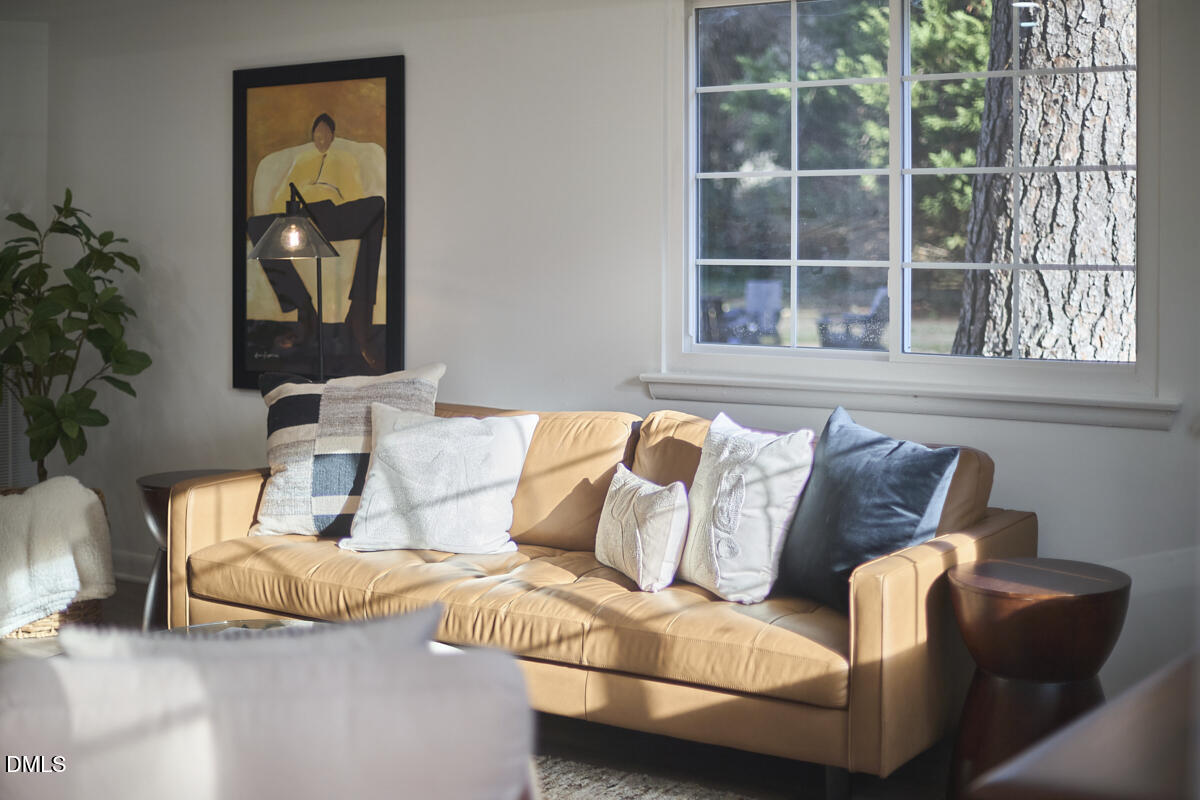 2613 McNeil Street, Unit F Raleigh, NC 27608 - Photo 5 of 30 a living room with furniture and a window