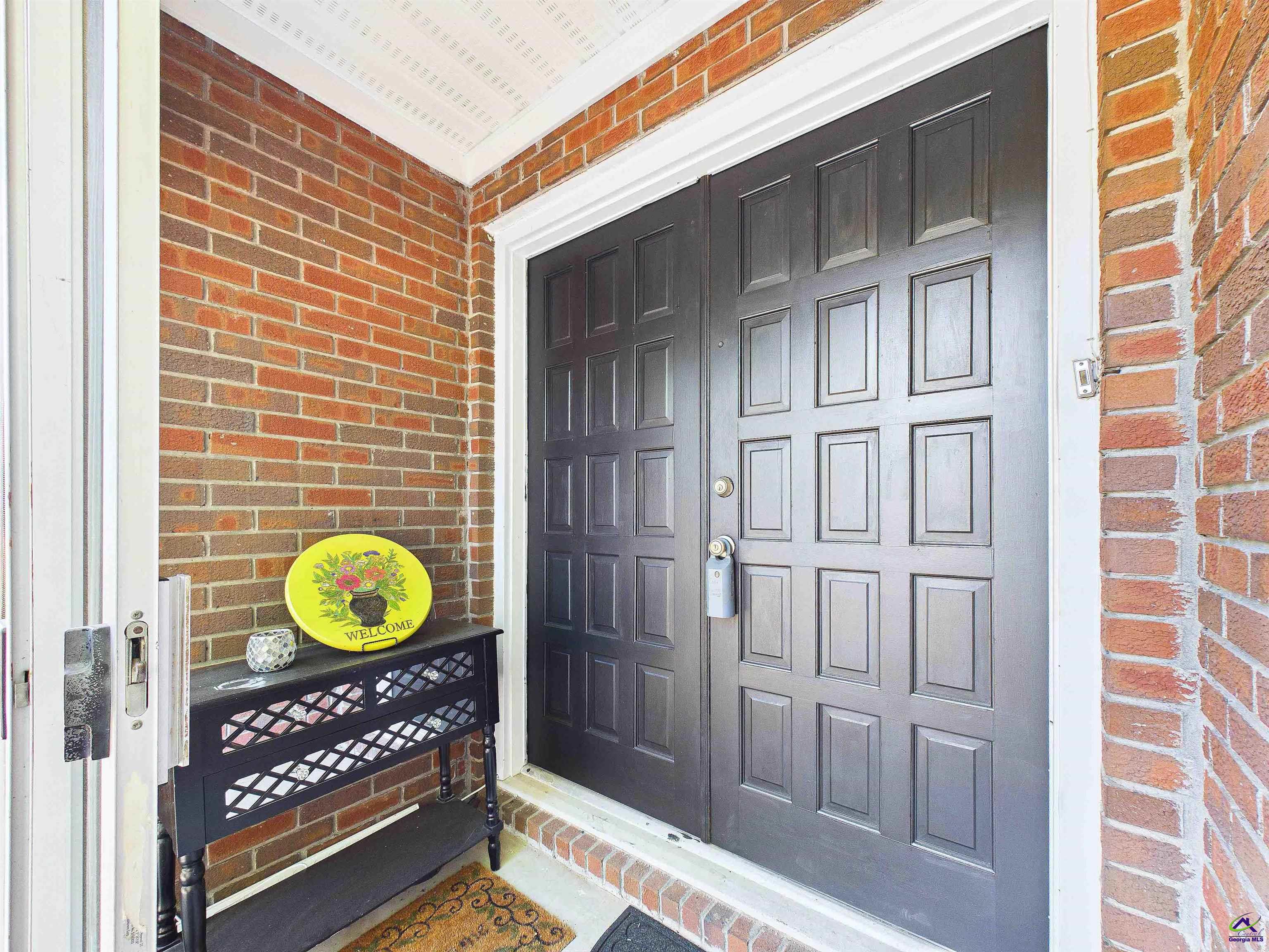 400 Feagin Mill Road Warner Robins, GA 31005 - Photo 7 of 53 a view of a door and wooden chair