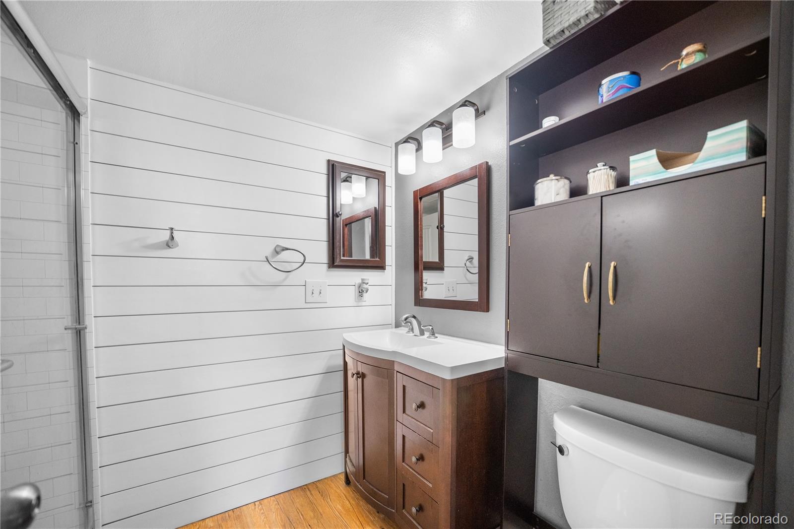 8567 Rabbitbrush Way Parker, CO 80134 - Photo 13 of 46 a bathroom with a sink a toilet and shower
