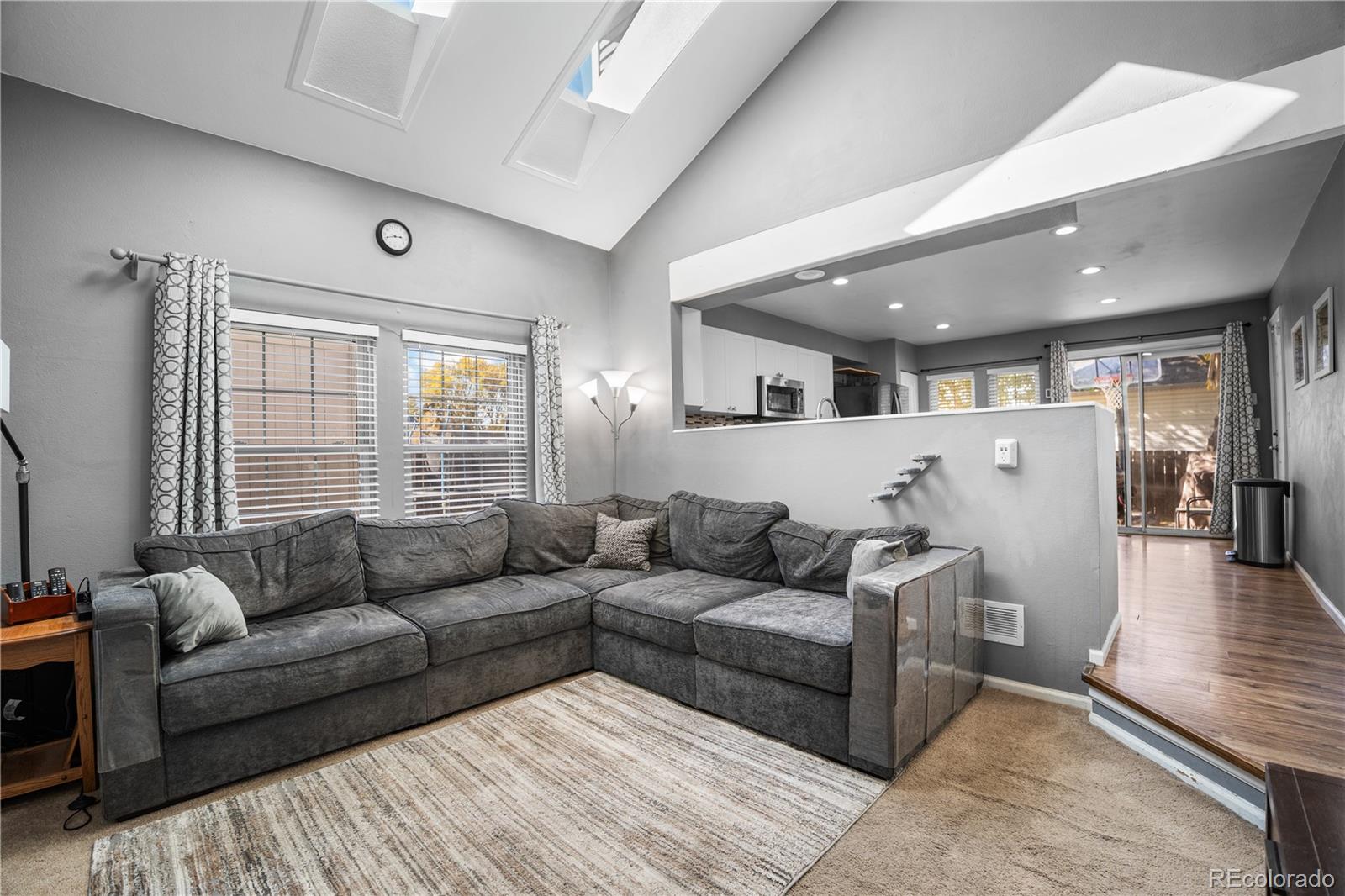 8567 Rabbitbrush Way Parker, CO 80134 - Photo 16 of 46 a living room with furniture and a large window