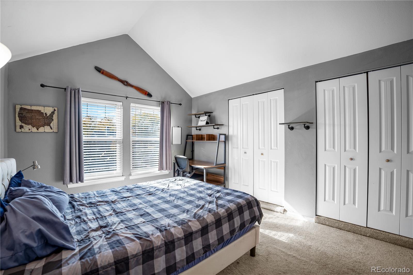 8567 Rabbitbrush Way Parker, CO 80134 - Photo 27 of 46 a bedroom with a large bed and a window