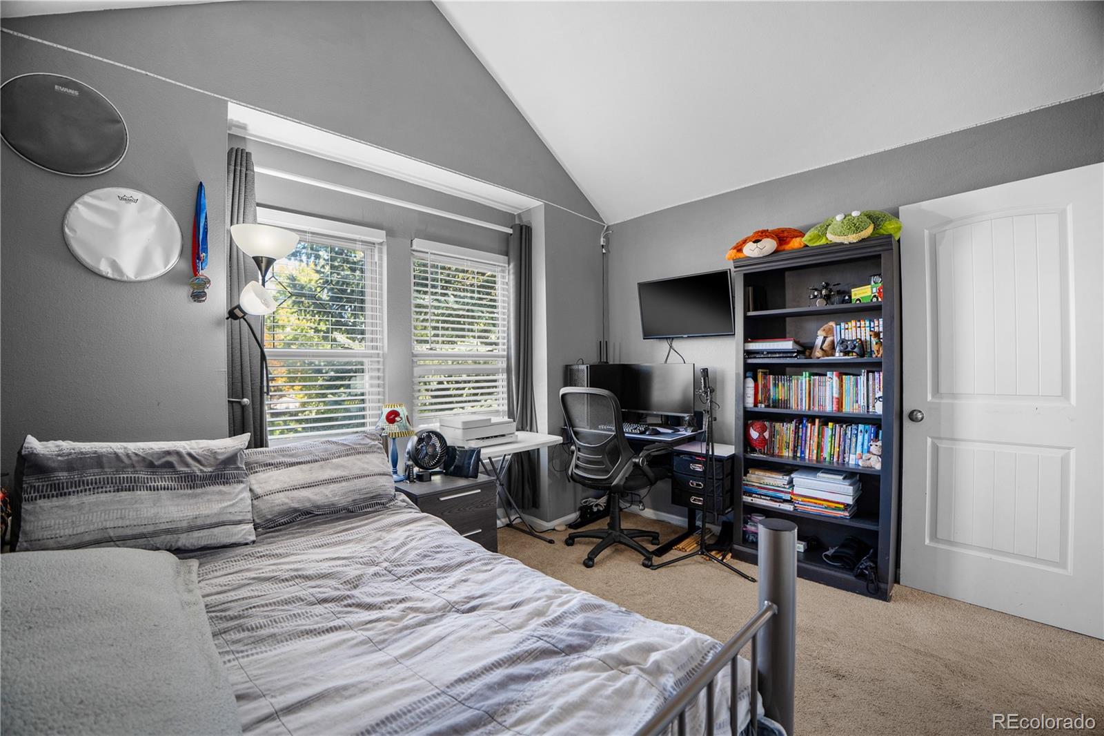 8567 Rabbitbrush Way Parker, CO 80134 - Photo 31 of 46 a bedroom with bed and a large window