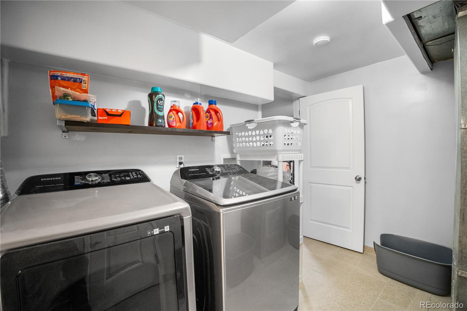 8567 Rabbitbrush Way Parker, CO 80134 - Photo 34 of 46 a utility room with dryer and washer