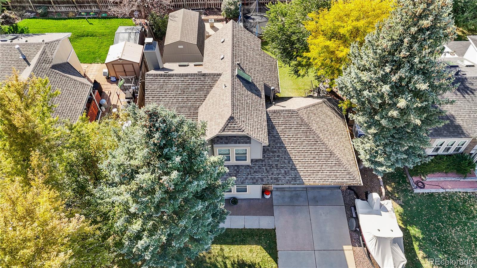 8567 Rabbitbrush Way Parker, CO 80134 - Photo 40 of 46 an aerial view of a house with garden space and trees