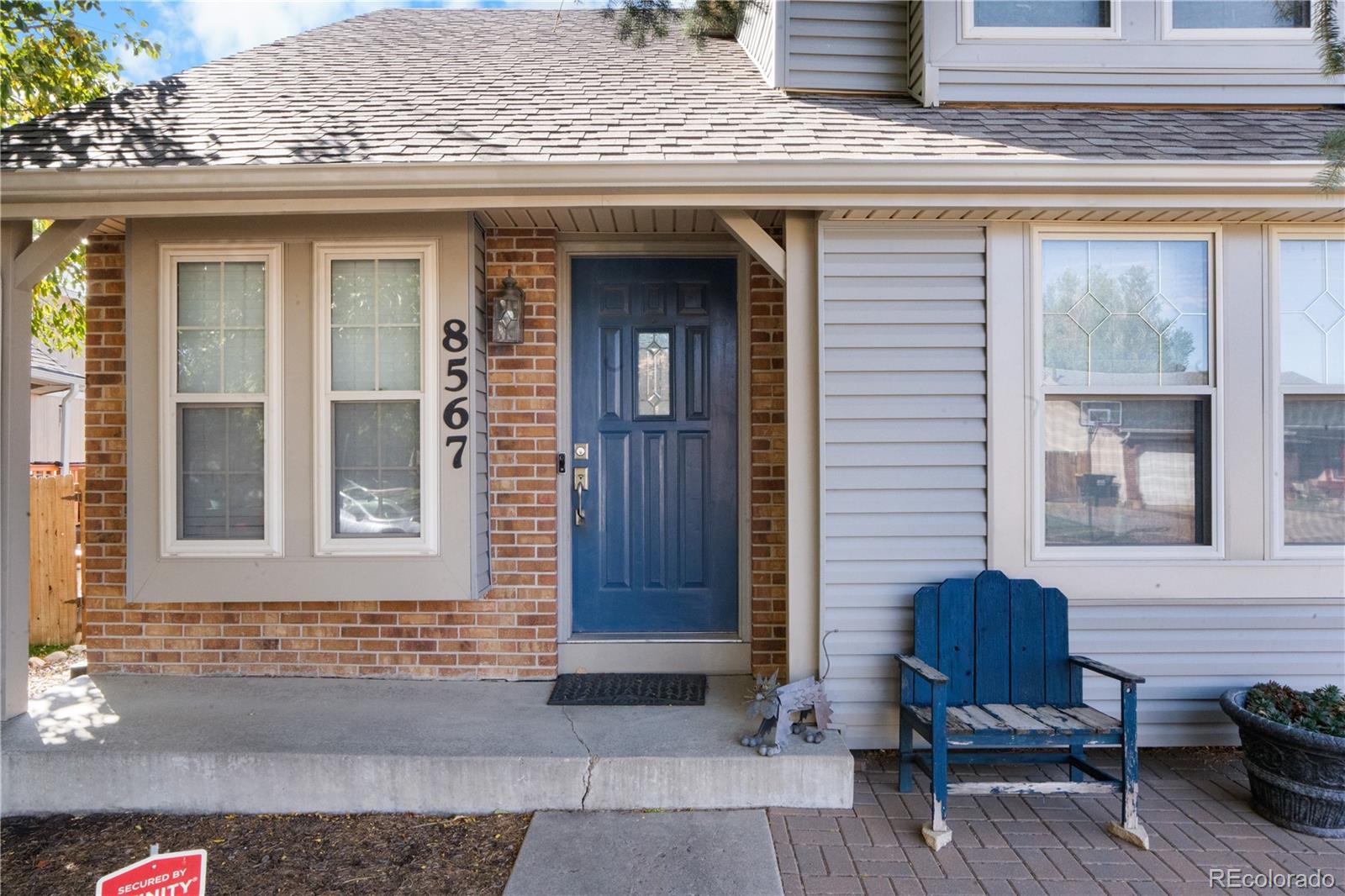 8567 Rabbitbrush Way Parker, CO 80134 - Photo 4 of 46 a front view of a house with a yard