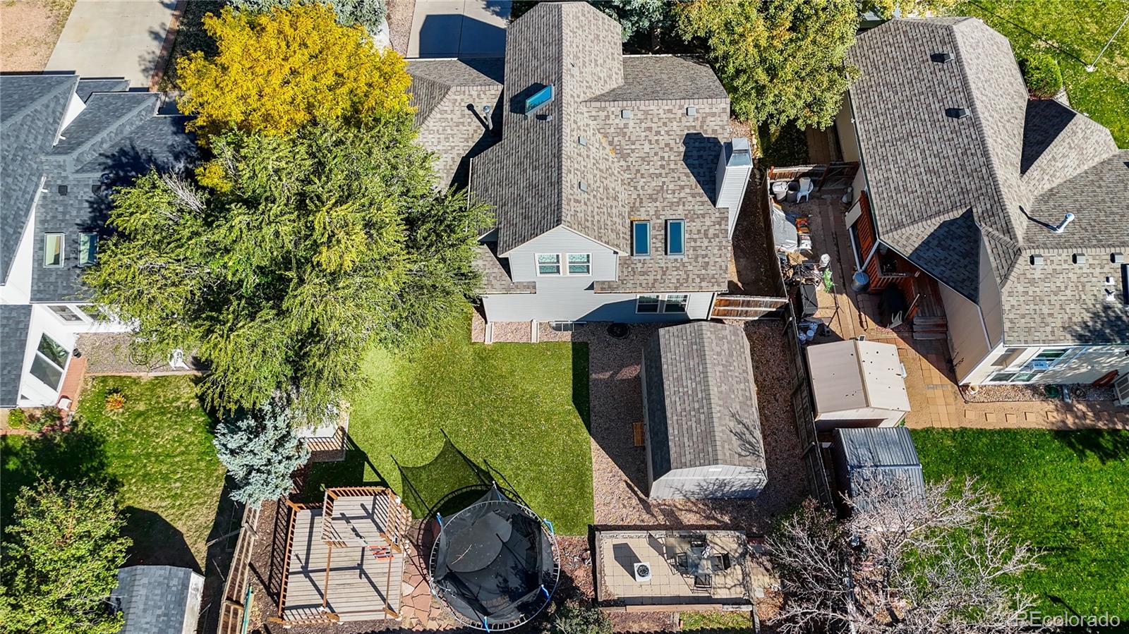 8567 Rabbitbrush Way Parker, CO 80134 - Photo 46 of 46 an aerial view of a house with garden space and swimming pool