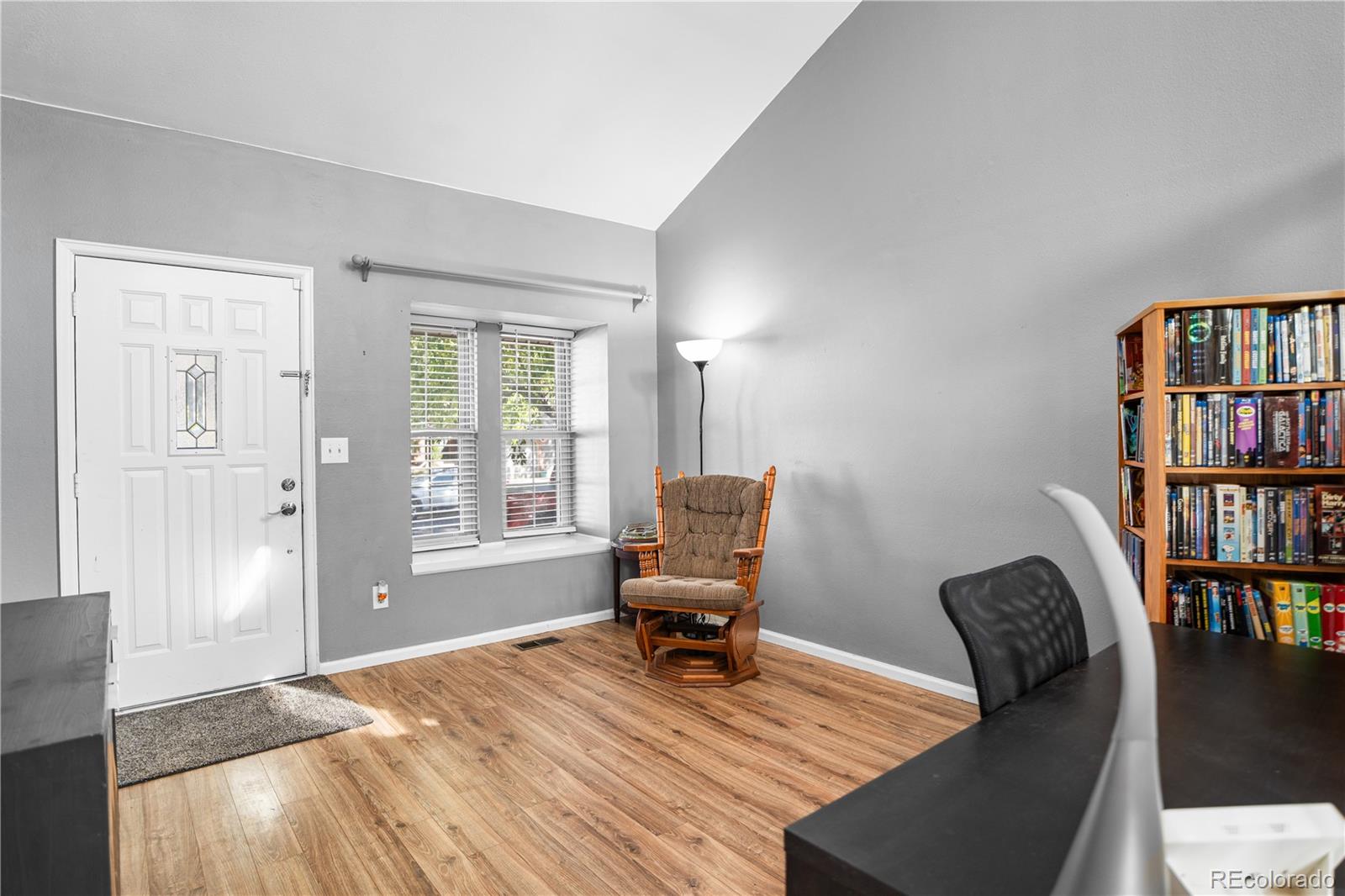 8567 Rabbitbrush Way Parker, CO 80134 - Photo 7 of 46 a workspace with furniture window and wooden floor