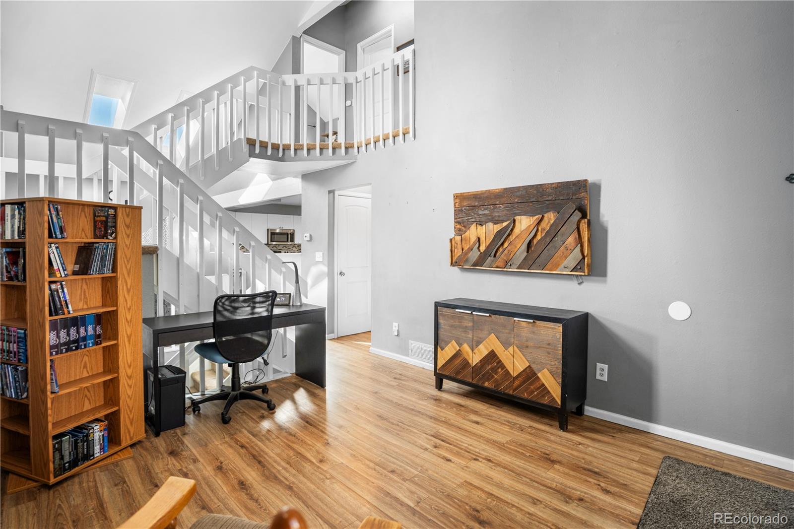 8567 Rabbitbrush Way Parker, CO 80134 - Photo 8 of 46 a living room with furniture and a fireplace