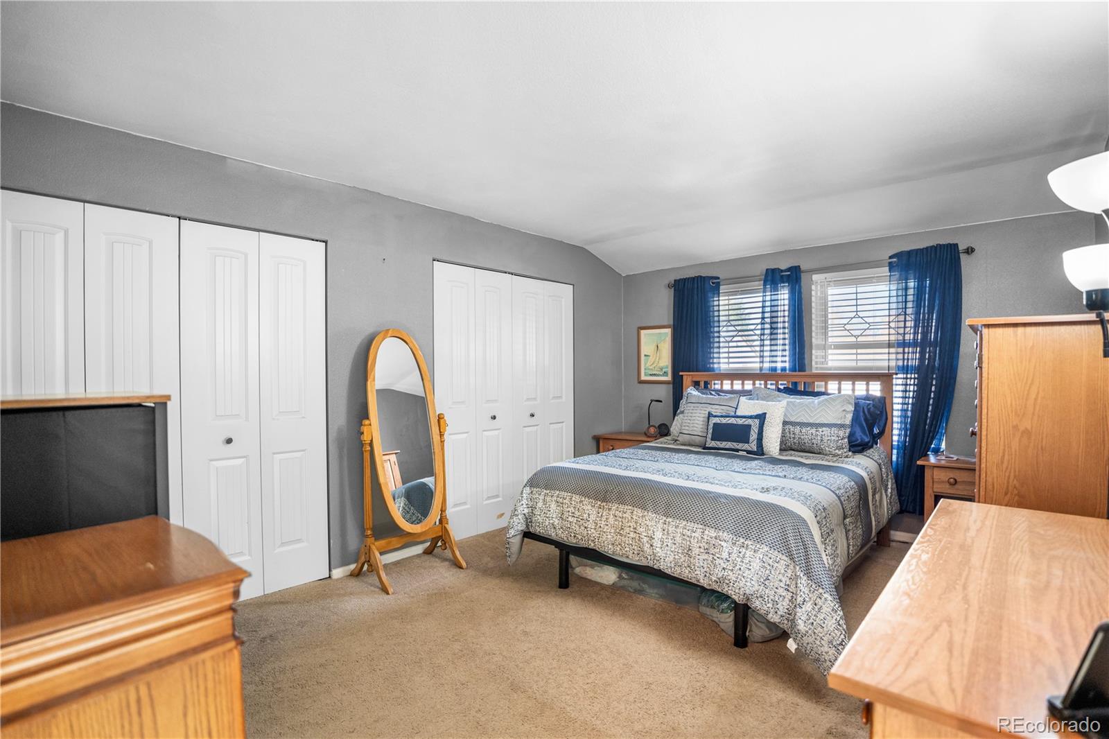 8567 Rabbitbrush Way Parker, CO 80134 - Photo 9 of 46 a bedroom with a bed and a dresser