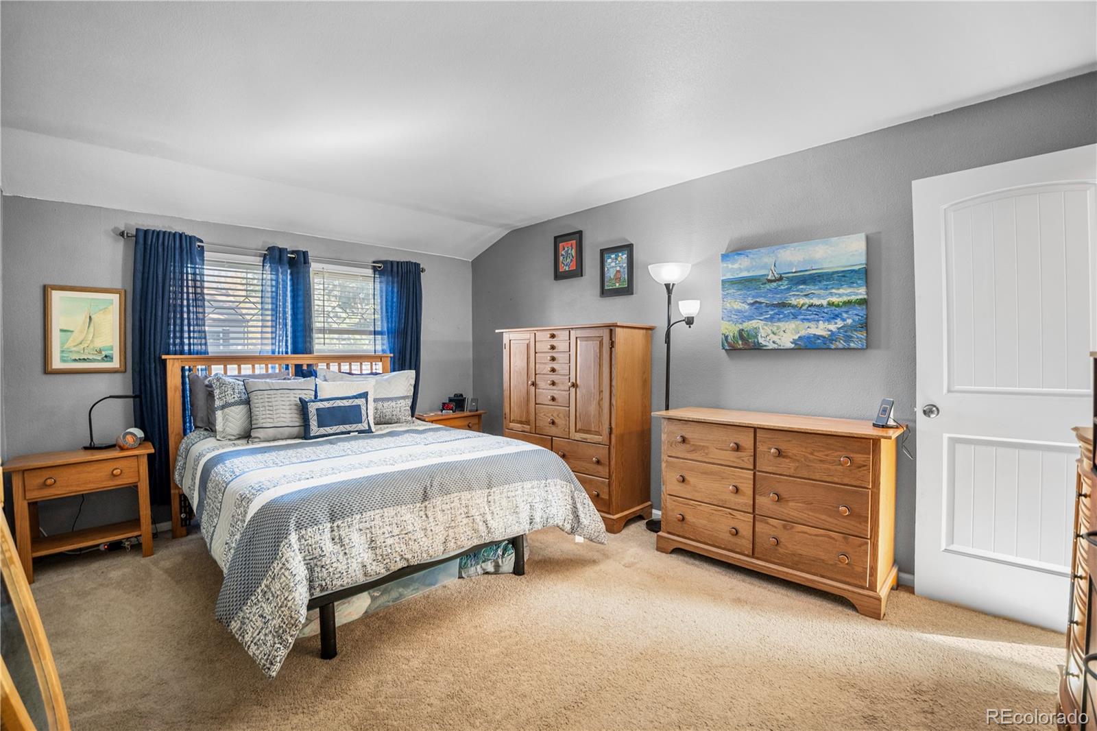 8567 Rabbitbrush Way Parker, CO 80134 - Photo 10 of 46 a spacious bedroom with a bed and dresser