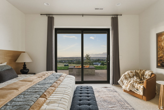 923 North Emery Lane Elk Ridge, UT 84651 - Photo 65 of 101 Spacious room featuring a sliding glass door, a private patio, and a built-in fire pit