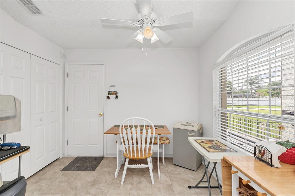 1727 Concert Road Deltona, FL 32738 - Photo 13 of 29 EAT IN AREA AND DOOR TO GARAGE