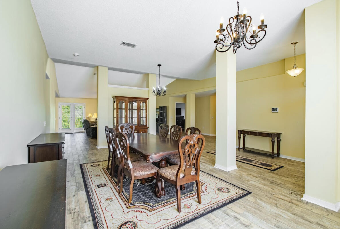 232 Raptor Drive Crestview, FL 32536 - Photo 13 of 42 a dining room with furniture window and wooden floor