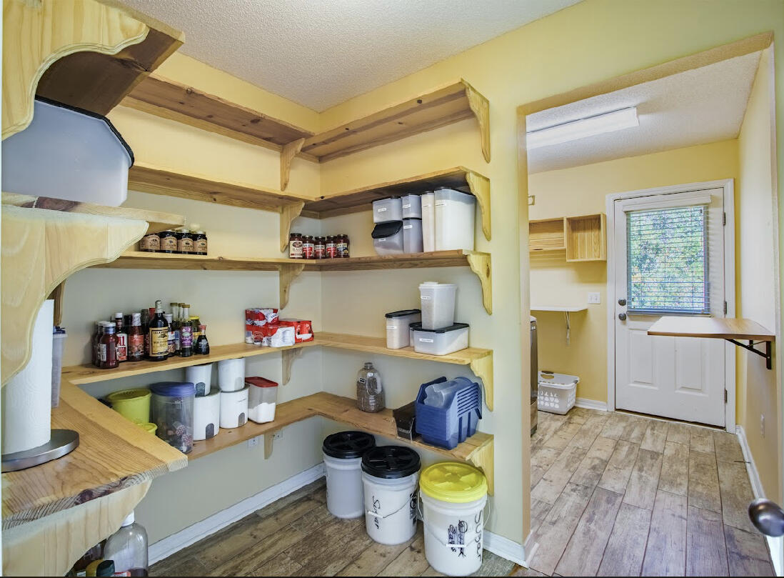 232 Raptor Drive Crestview, FL 32536 - Photo 19 of 42 a room with a wooden floor and sink