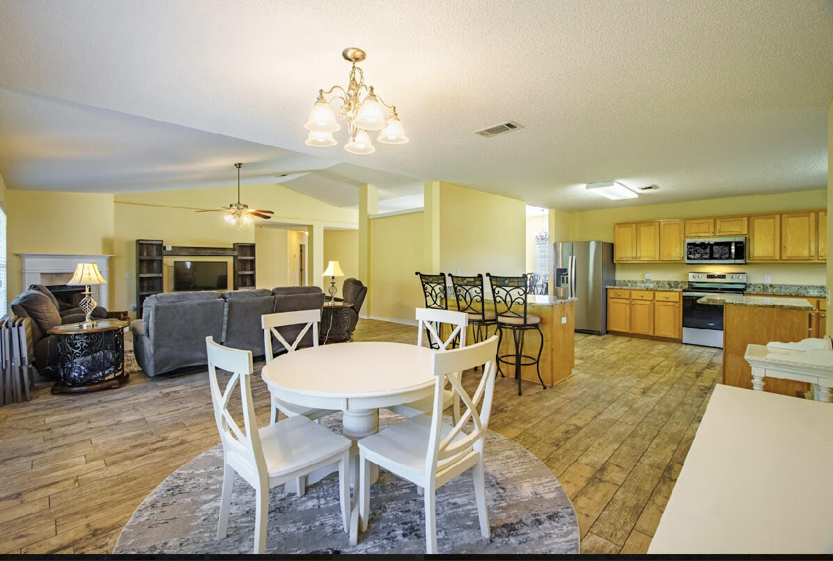 232 Raptor Drive Crestview, FL 32536 - Photo 22 of 42 a view of a dining room with furniture