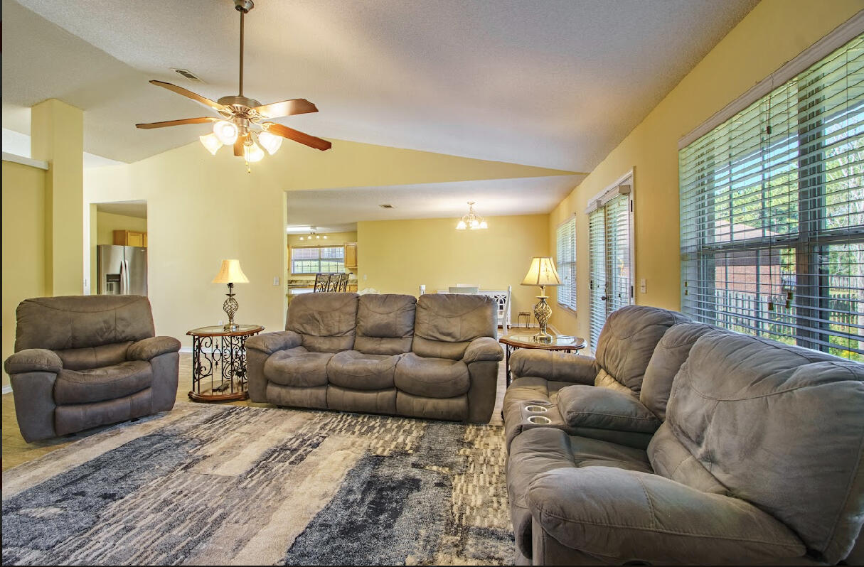 232 Raptor Drive Crestview, FL 32536 - Photo 26 of 42 a living room with furniture and a large window