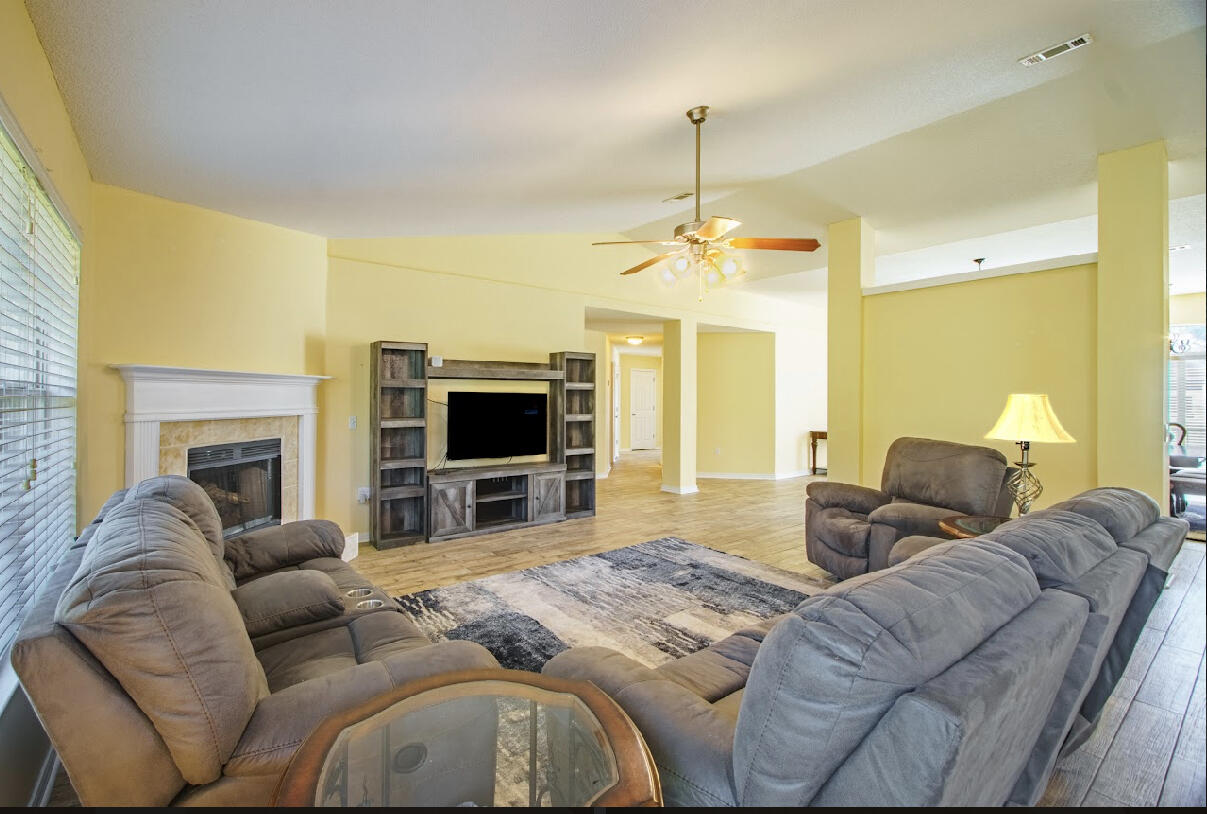 232 Raptor Drive Crestview, FL 32536 - Photo 27 of 42 a living room with furniture and a flat screen tv