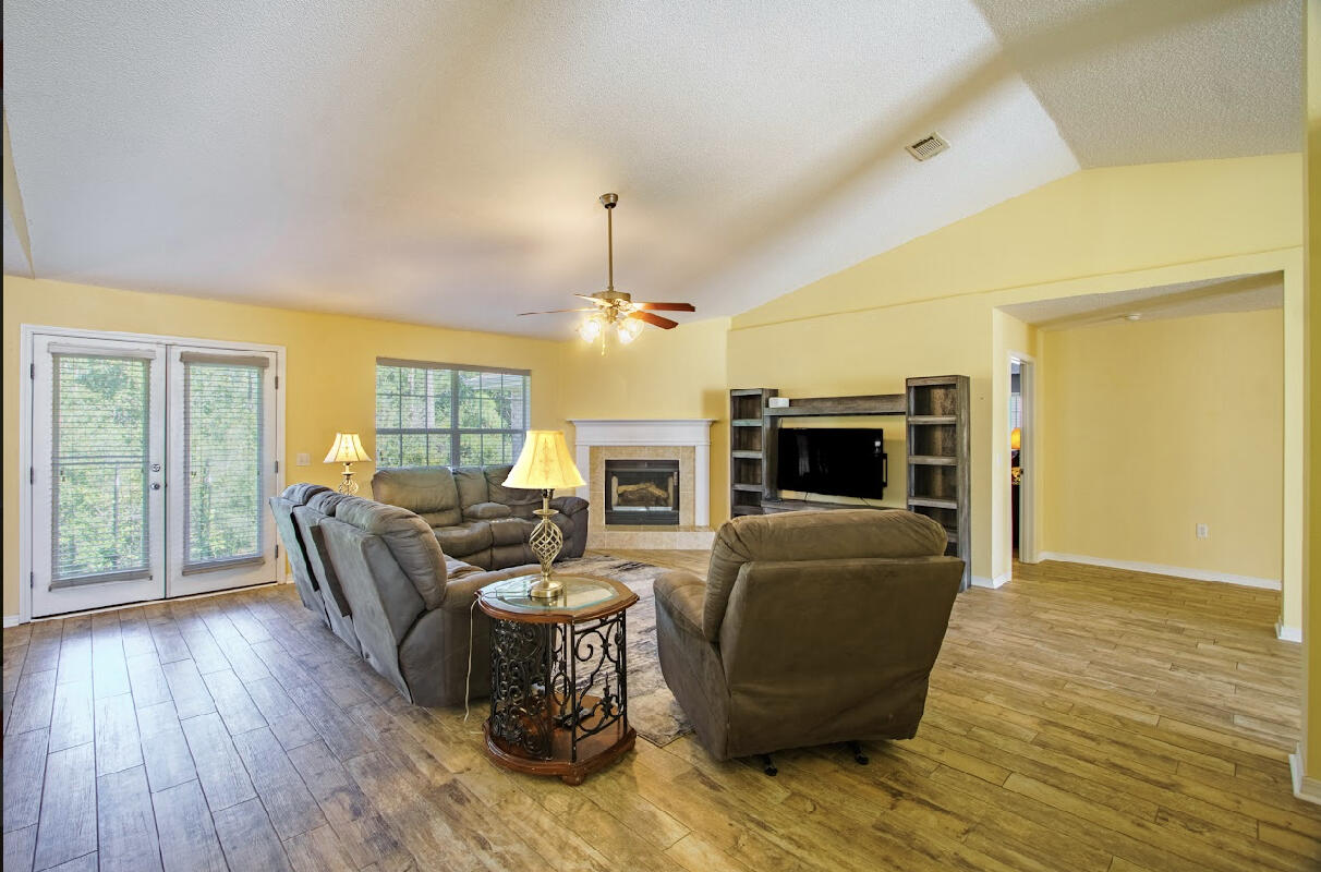 232 Raptor Drive Crestview, FL 32536 - Photo 28 of 42 a living room with furniture and a flat screen tv