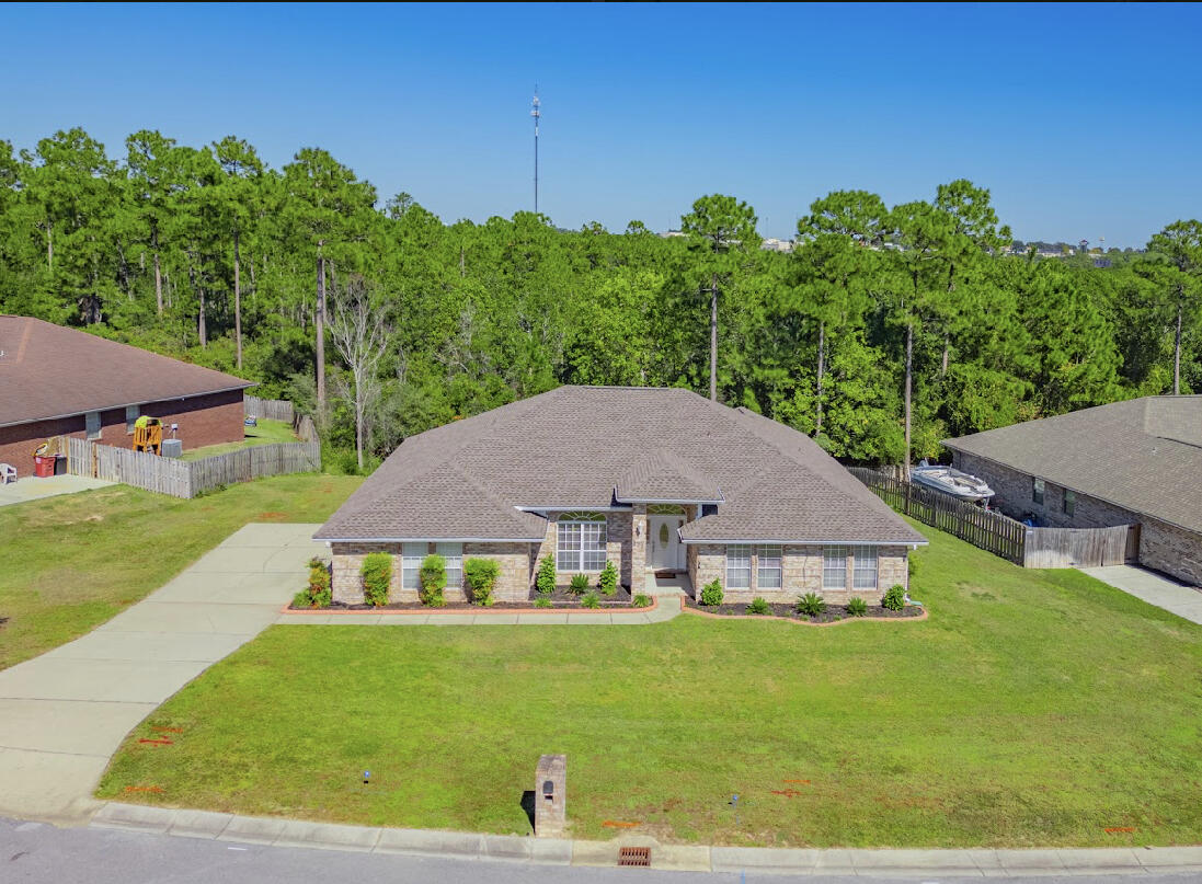 232 Raptor Drive Crestview, FL 32536 - Photo 3 of 42 a view of house with garden space and trees