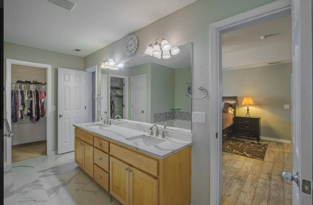 232 Raptor Drive Crestview, FL 32536 - Photo 32 of 42 a bathroom with a sink and a mirror