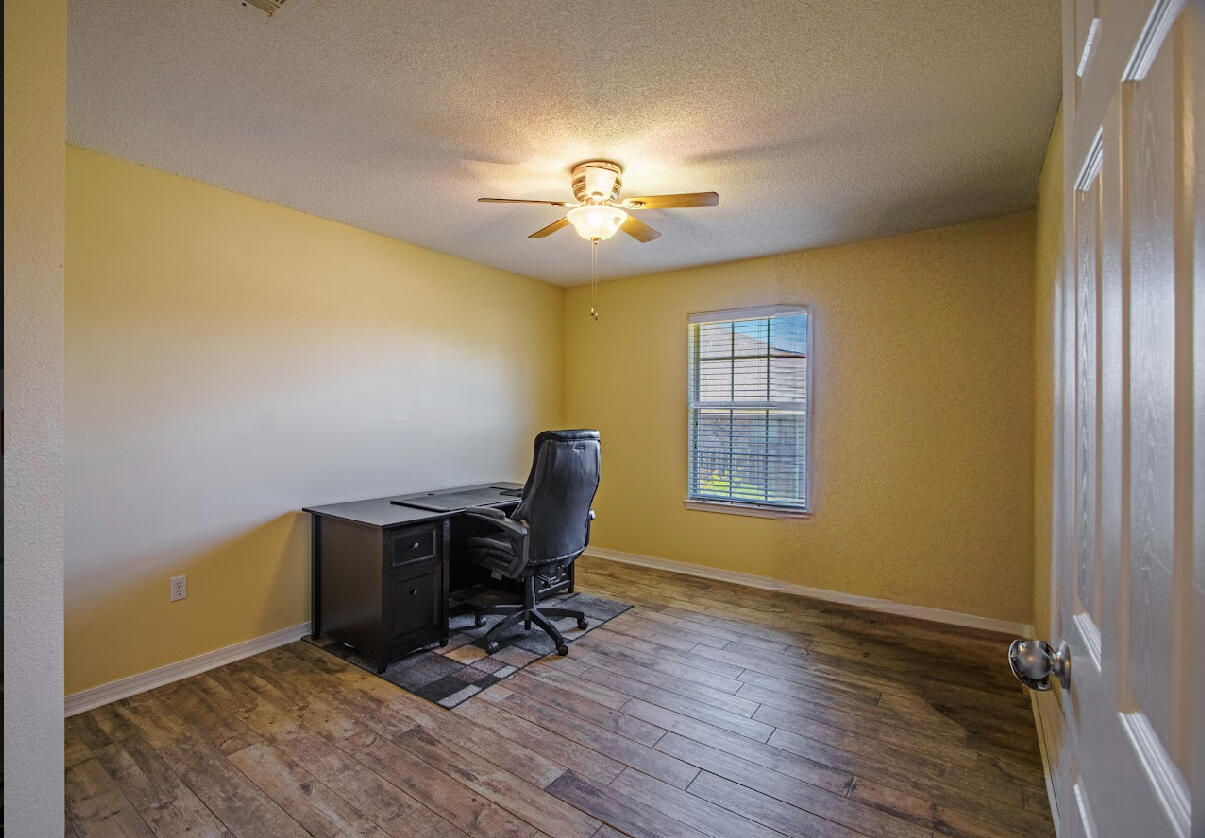 232 Raptor Drive Crestview, FL 32536 - Photo 35 of 42 a view of workspace with wooden floor windows and piano