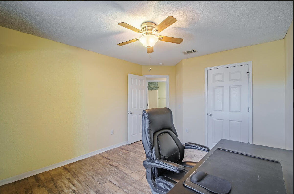 232 Raptor Drive Crestview, FL 32536 - Photo 36 of 42 a workspace with wooden floor and workspace