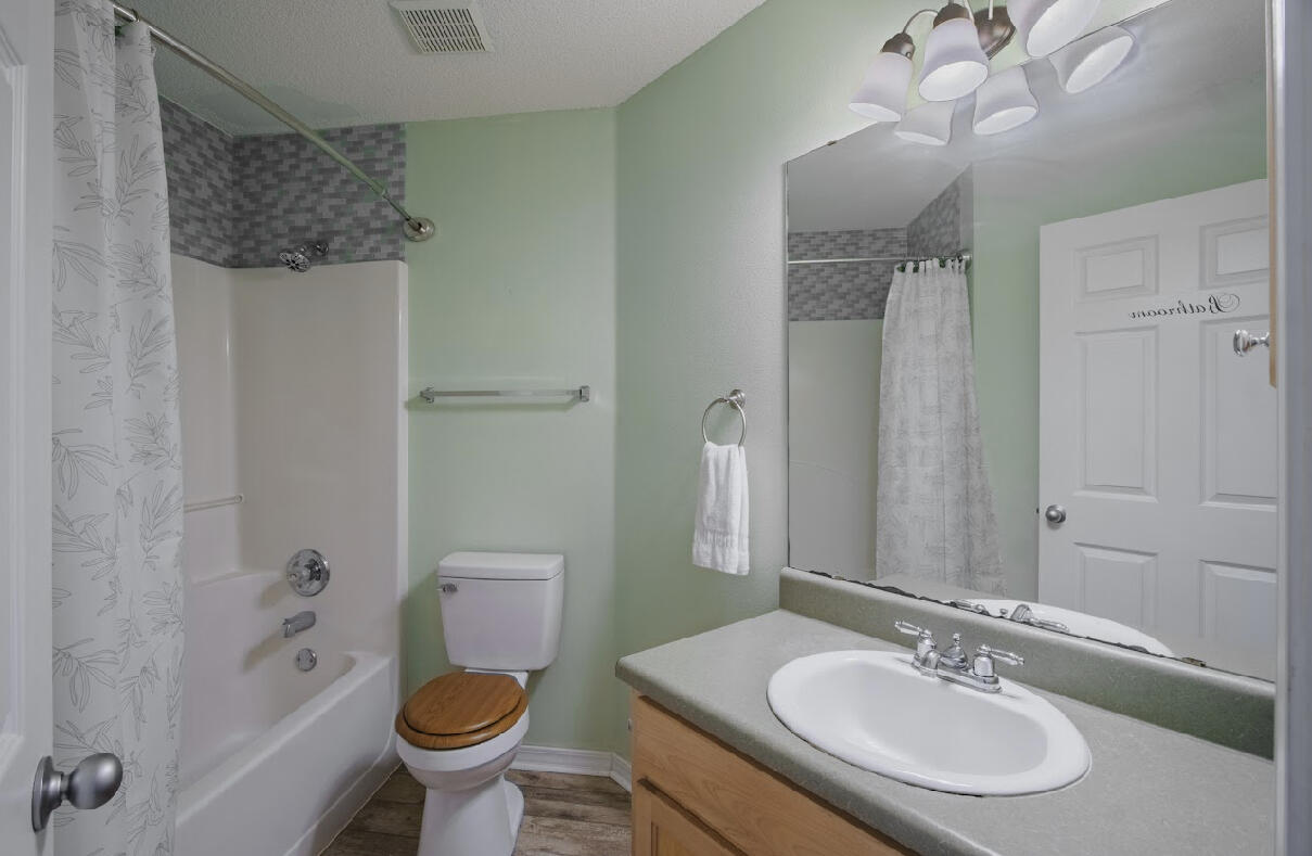 232 Raptor Drive Crestview, FL 32536 - Photo 37 of 42 a bathroom with a sink toilet and shower