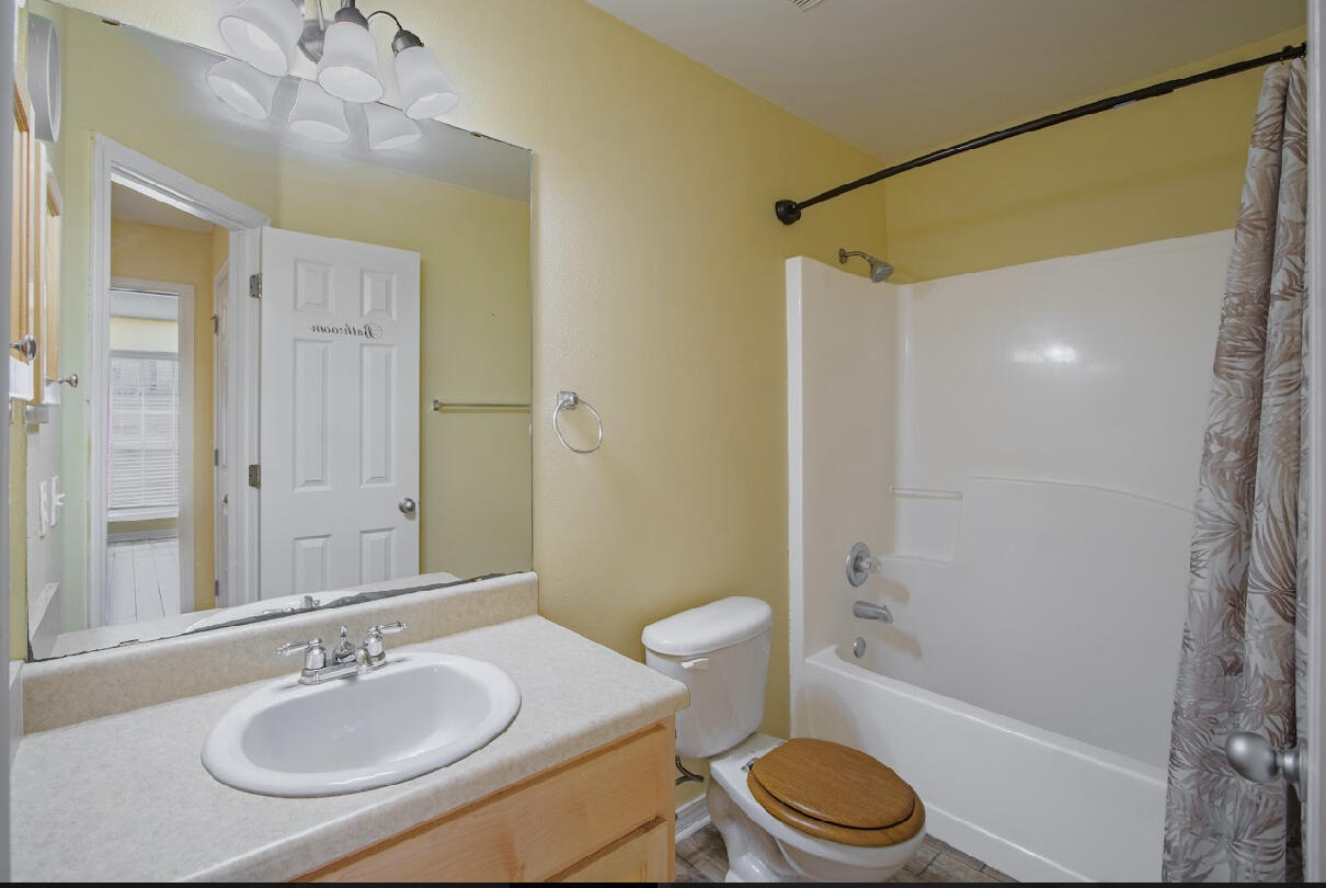 232 Raptor Drive Crestview, FL 32536 - Photo 40 of 42 a bathroom with a sink toilet and shower