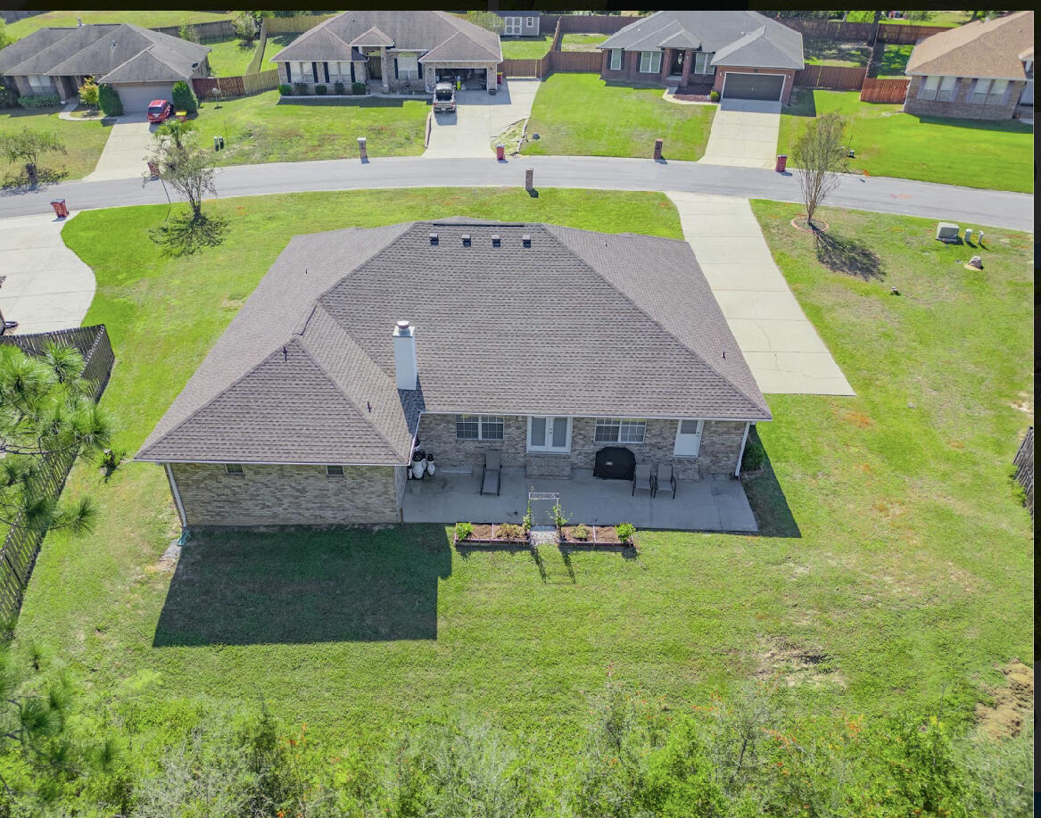 232 Raptor Drive Crestview, FL 32536 - Photo 4 of 42 a view of a swimming pool with a yard