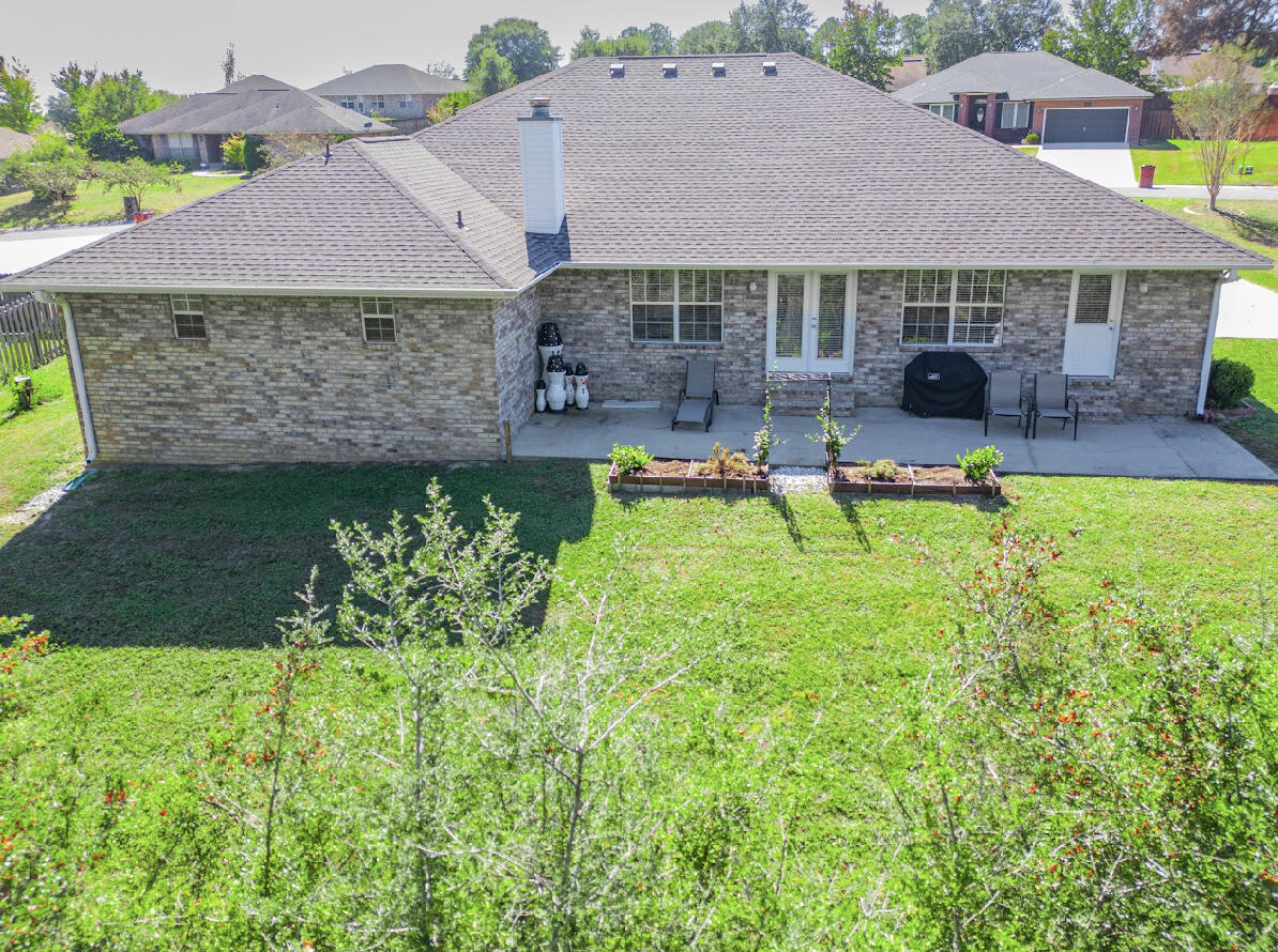 232 Raptor Drive Crestview, FL 32536 - Photo 5 of 42 a view of a house with a yard and sitting area