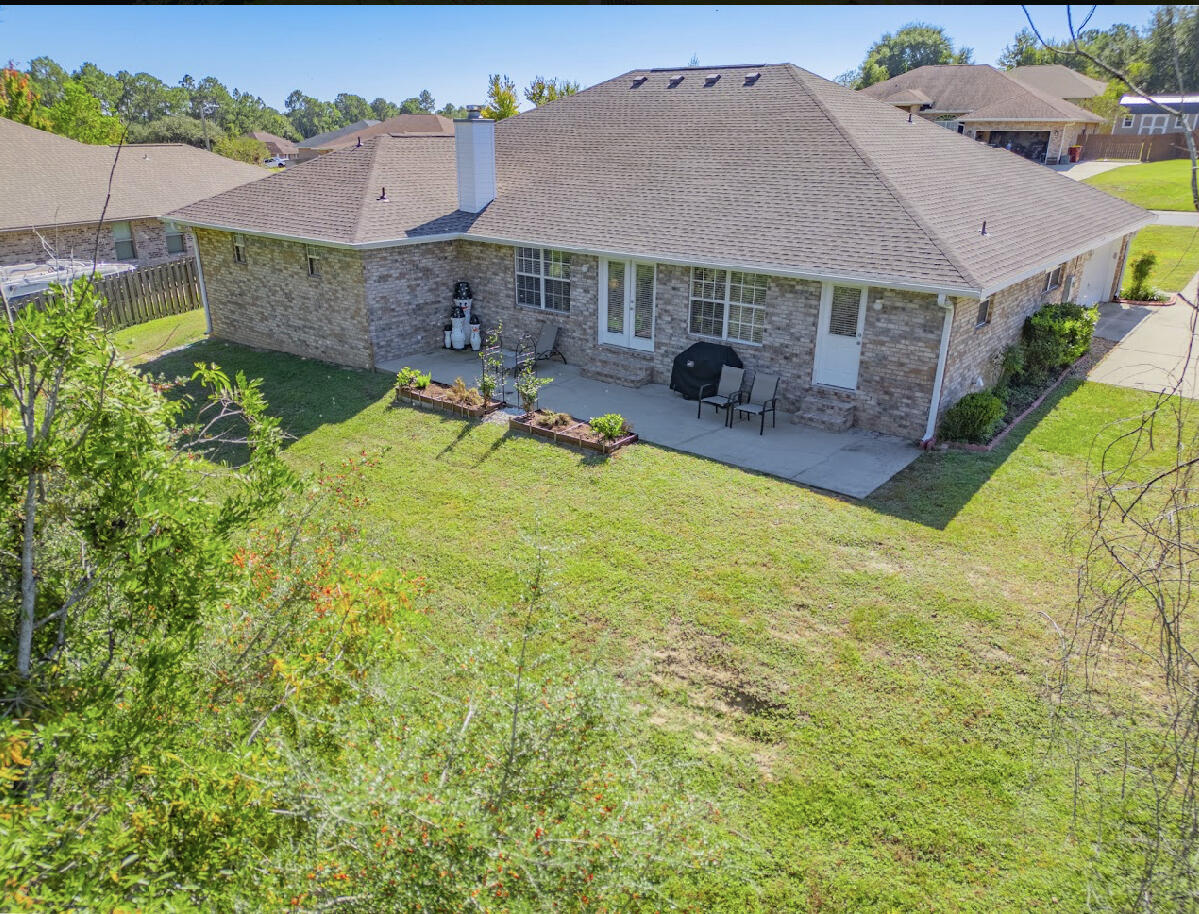 232 Raptor Drive Crestview, FL 32536 - Photo 6 of 42 an aerial view of a house with swimming pool and porch