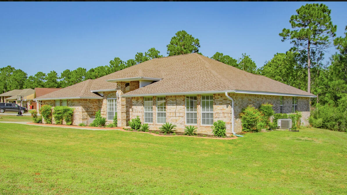 232 Raptor Drive Crestview, FL 32536 - Photo 8 of 42 a view of a house with a yard