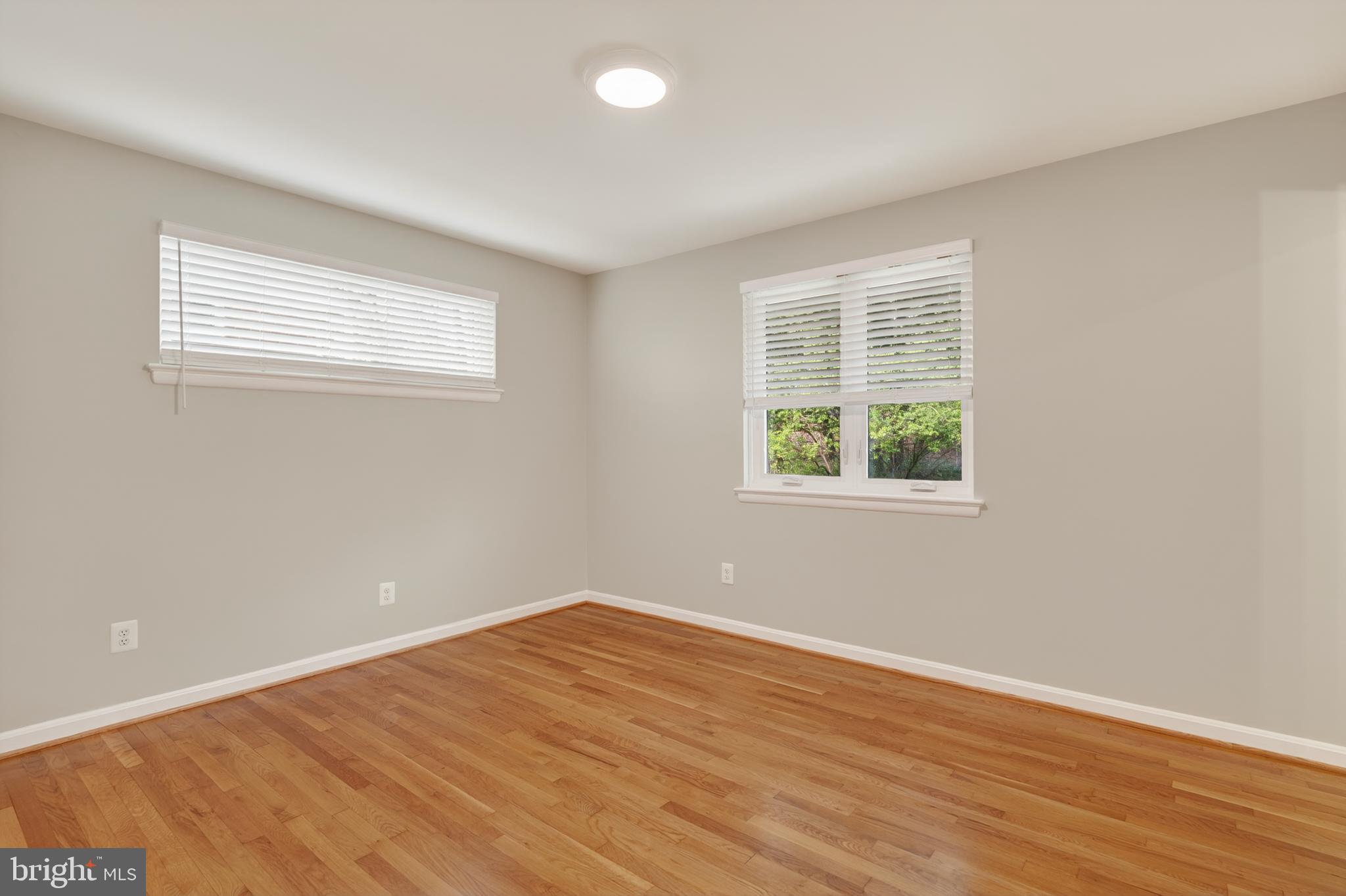 4625 Strathblane Place Alexandria, VA 22304 - Photo 11 of 22 a view of a room with wooden floor and windows in it