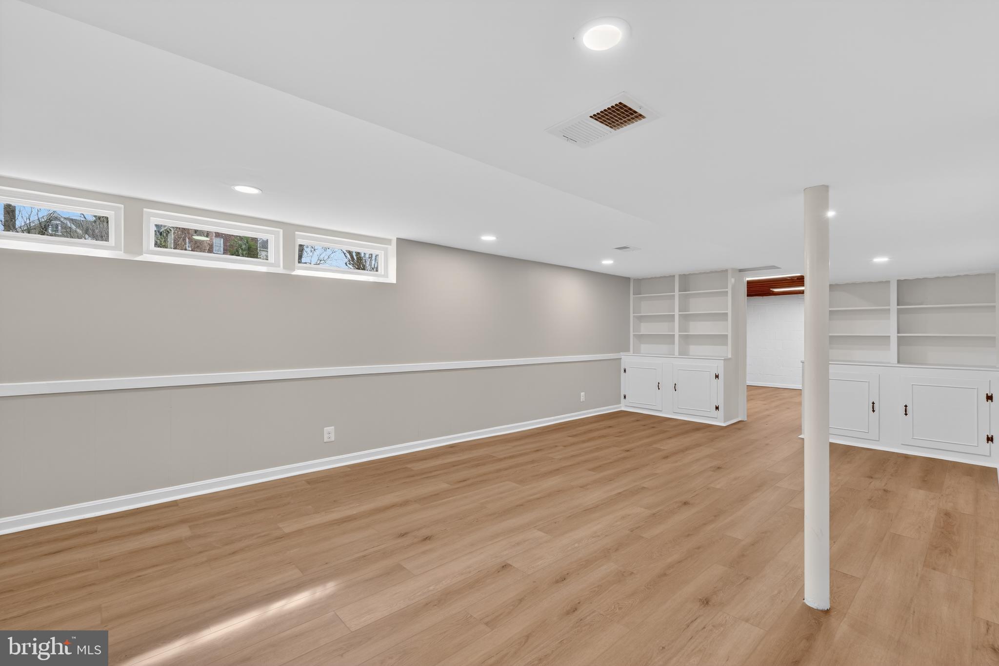 4625 Strathblane Place Alexandria, VA 22304 - Photo 14 of 22 an empty room with wooden floor and windows