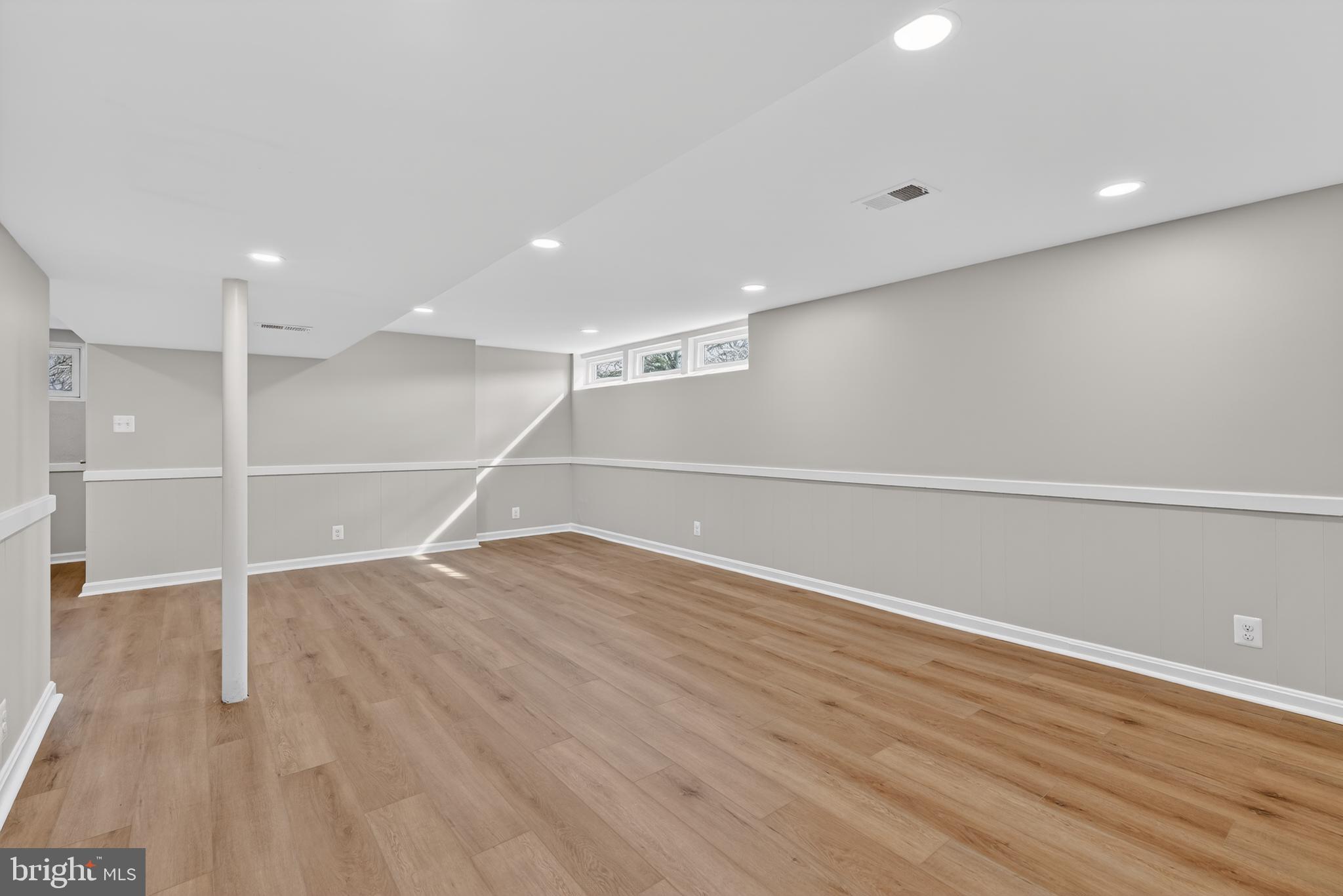 4625 Strathblane Place Alexandria, VA 22304 - Photo 15 of 22 an empty room with wooden floor and windows
