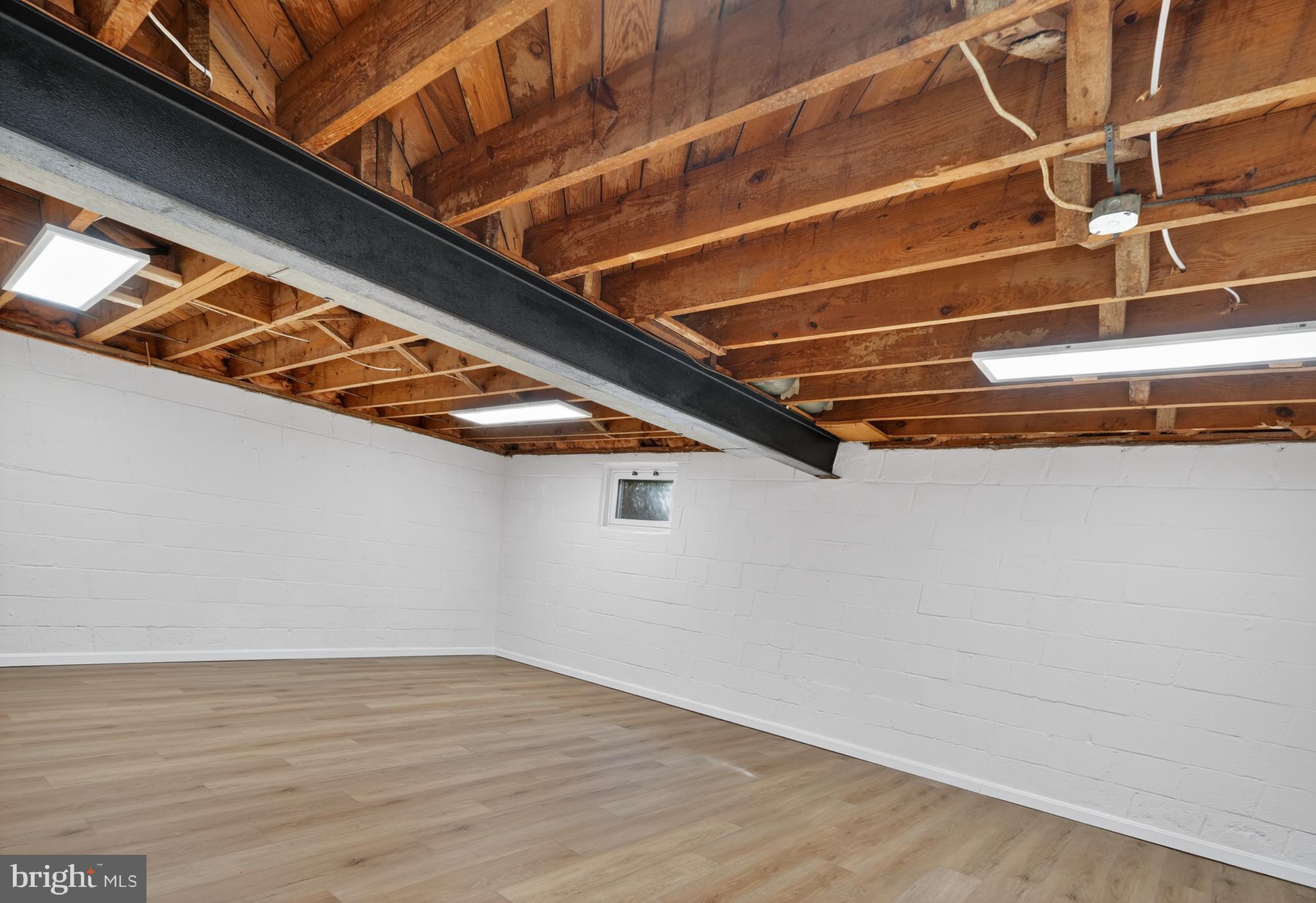 4625 Strathblane Place Alexandria, VA 22304 - Photo 16 of 22 a view of an empty room with wooden floor