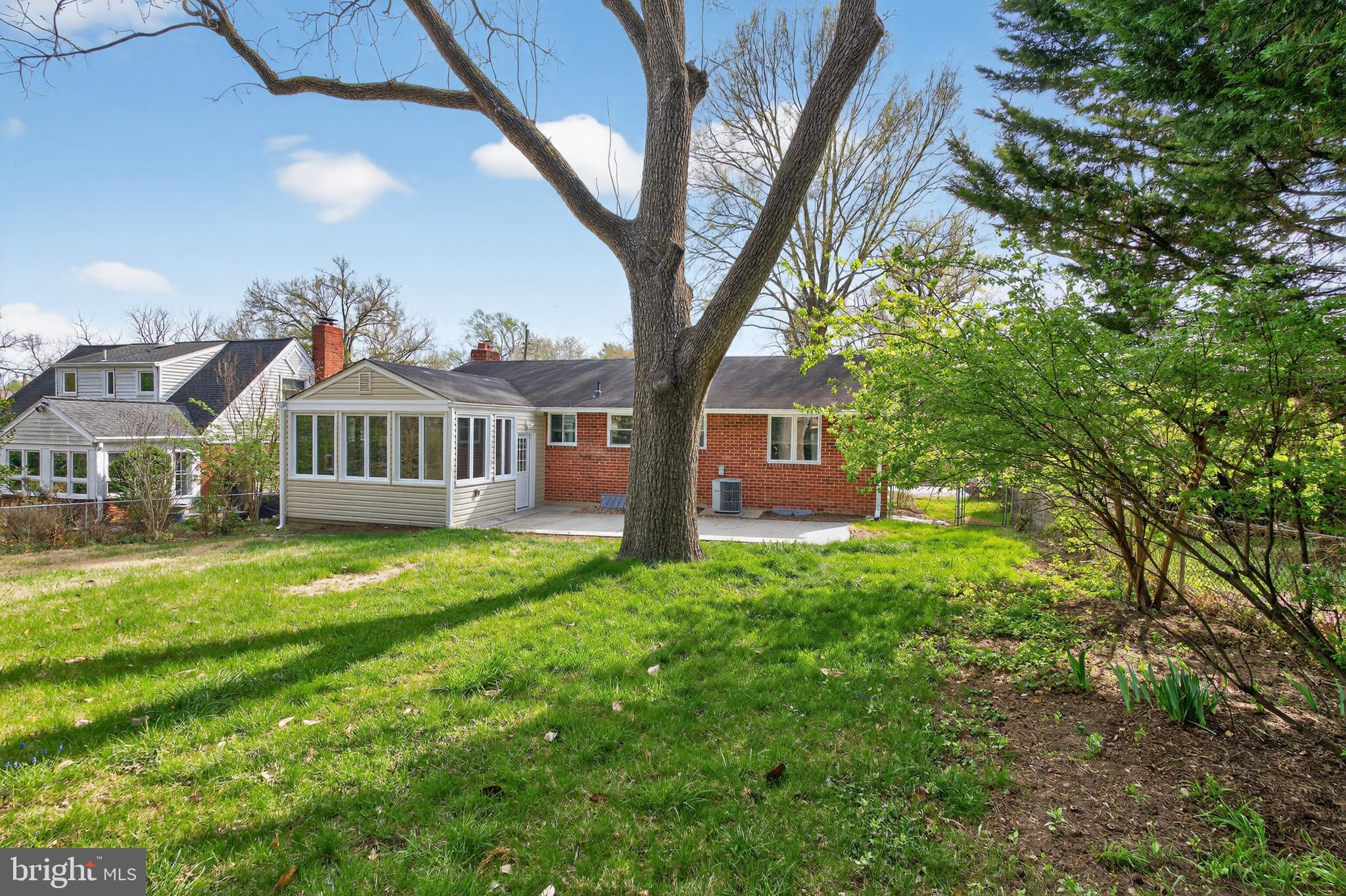 4625 Strathblane Place Alexandria, VA 22304 - Photo 21 of 22 a front view of house with yard and green space